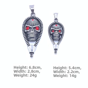 Detailed comparison of vintage skull pendants with red eyes in two sizes with dimensions