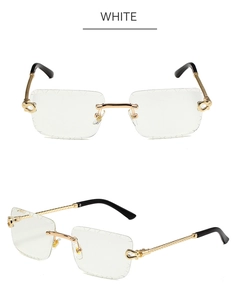 Detail of rimless square sunglasses with twisted metal temples and C-decor hinge detail