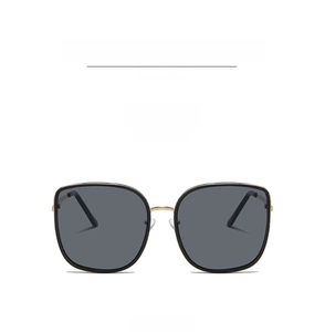 Detailed front view of square oversized sunglasses with black frame and gold metal bridge