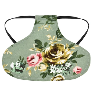 Detailed close-up of the floral canvas poultry saddle protector with floral rose pattern