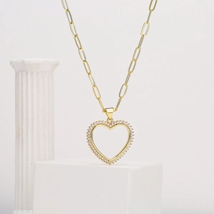Gold plated paperclip chain necklace with a hollow heart pendant set with sparkling zircons