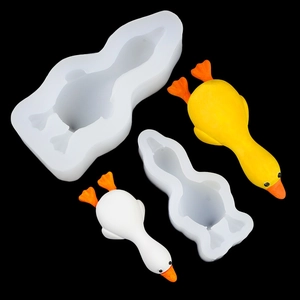 Silicone duck mold for 3D mousse cake and crafts with yellow and white finished ducks