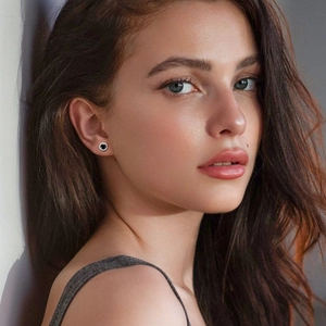 Elegant S925 sterling silver stud earrings with black moissanite and halo stones on model