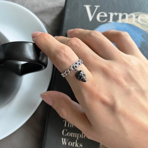 S925 sterling silver chain ring with skull pendant and crystals in lifestyle setting