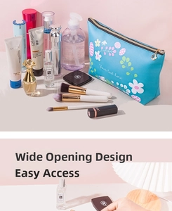 Detail view of the wide-open large capacity blue floral PU makeup storage bag