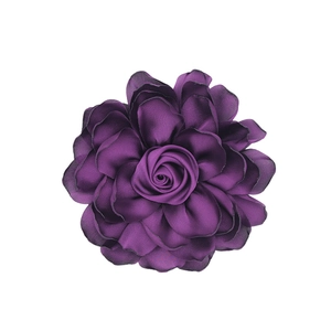 Macro shot of dark purple satin fabric flower petals with layered 3D rose craftsmanship
