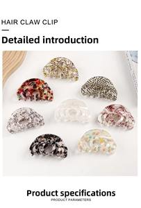 Detail view of eight large acetate hair claws in various marble and leopard patterns