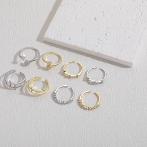 Set of 8 adjustable geometric cross rings with white zircon in gold and silver finish