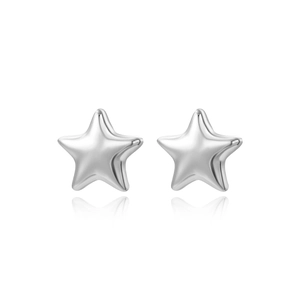 Macro view of minimalist silver star stud earrings with high-polish metallic finish