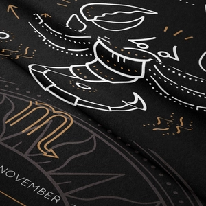 Detail of Scorpio zodiac tapestry fabric showing soft texture and golden print