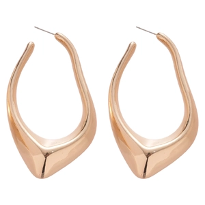 Irregular geometric wavy gold stud earrings with a glossy metallic finish on white background