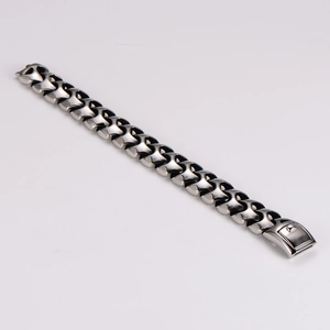 Macro view of geometric stainless steel links and mechanical clasp on the silver bracelet