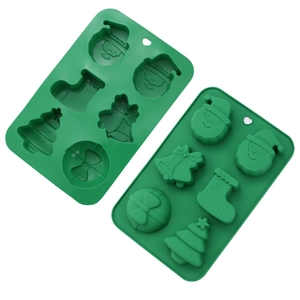 Detail of 6-cavity green silicone Christmas mold with Santa and tree patterns