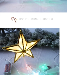 Detail of glowing LED Christmas star tree topper with USB cable and battery box setup