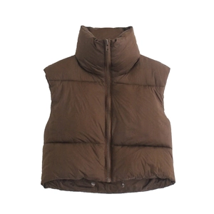 Detail view of the brown quilted vest featuring a stand collar and smooth front zipper
