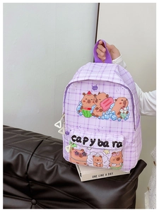 Close-up of purple plaid backpack with cute capybara print and durable double zippers