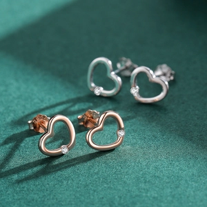 Elegant s925 silver and rose gold hollow heart stud earrings with sparkling crystals