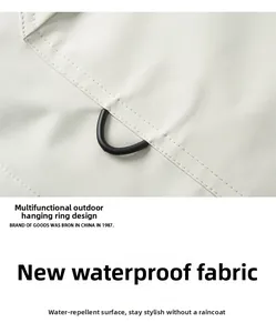Detail of waterproof jacket fabric with D-ring hook and premium reinforced stitching