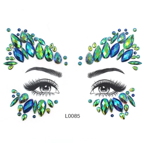 Detail of teal and green iridescent face jewels in mixed waterdrop and diamond cuts