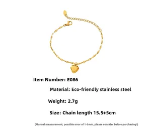 Detailed view of 18K gold heart pendant bracelet with lobster clasp and extension chain