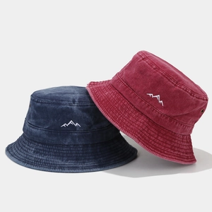 Vintage washed cotton bucket hats with mountain embroidery in navy blue and burgundy colors