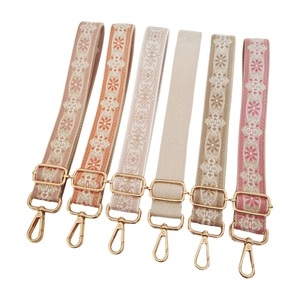 Adjustable ethnic style jacquard wide bag straps with gold metal hooks on white background