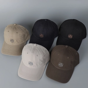 Detailed display of vintage baseball caps in five colors with circular shield embroidery