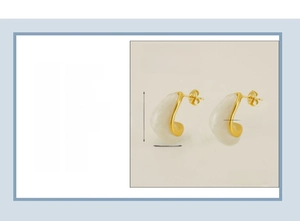 Detail view of gold stainless steel teardrop earrings with white resin inlay and 18K plating