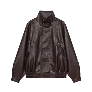 Detailed macro of vintage dark brown PU leather jacket with ribbed hem and metallic buttons