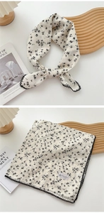 Close-up of floral print cotton linen square scarf with delicate black lace trim edges