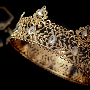 Luxury vintage baroque king crown in gold alloy with intricate crystal leaf patterns