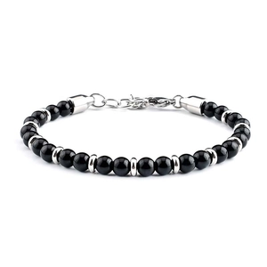Macro detail of black map stone beads with silver spacer beads and lobster clasp