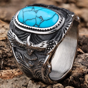 Vintage silver eagle ring for men featuring an oval blue turquoise stone and tribal patterns