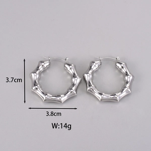 Detail shot of silver bamboo-style hoop earrings with size measurements in centimeters