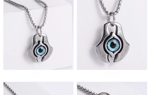 Detail of blue evil eye pendant on round box chain with rustproof stainless steel finish
