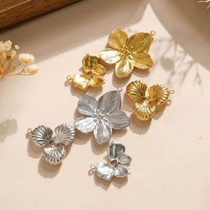 Textured 304 stainless steel bow and flower pendants in gold and silver finishes
