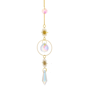 Detailed view of brass suncatcher with crystal prisms and golden sun metal ornament