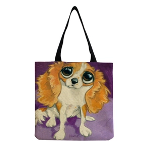 Close-up of canvas tote bag with artistic big-eyed dog oil painting and black handles