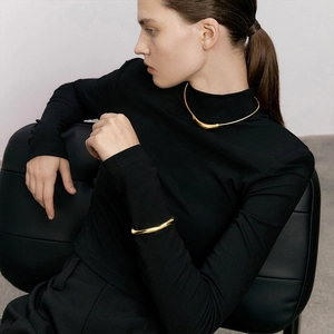 Minimalist gold curved pendant collar necklace and matching cuff bracelet set for women