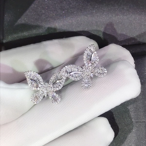 Detailed macro view of butterfly earrings encrusted with sparkling cubic zirconia stones