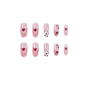 Pink translucent press-on nails set with red hearts, leopard French tips and silver rhinestones