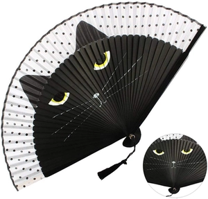 Detail of a Japanese style folding fan shaped like a black cat head with a silk tassel