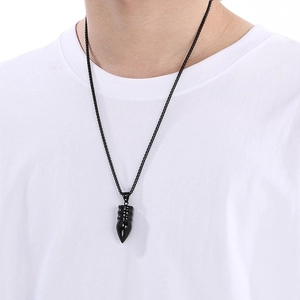Men's hip hop black bullet pendant necklace with stainless steel chain on white t-shirt