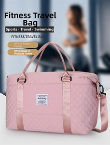 Close-up of the front zipper pocket and quilted texture on pink yoga travel bag