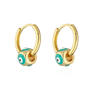 Detail of gold-plated hoop earrings featuring turquoise evil eye enamel charms on white background