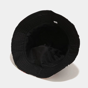Detail view of the black cotton inner lining and stitching of the mushroom bucket hat