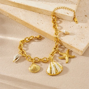 Gold stainless steel chain bracelet featuring starfish, seashell and conch charms