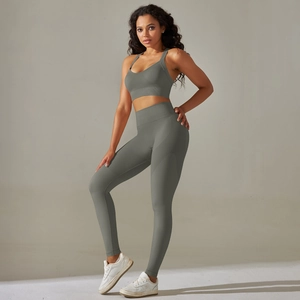 Close-up of seamless ribbed knit fabric on a cross-back sports bra and yoga leggings set