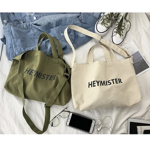 Unisex canvas crossbody bag with Heymister print in army green and off-white