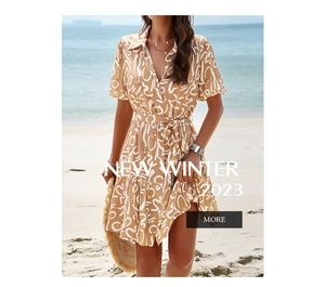 Detail of short sleeves and collar on elegant geometric print dress with sun patterns